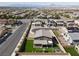 Wide aerial perspective of the home, showcasing its well-manicured backyard, surroundings, and community at 1297 Ventura Cliffs Ave, Henderson, NV 89012