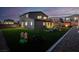 Expansive backyard with artificial turf, play equipment, and an outdoor entertaining space at 1297 Ventura Cliffs Ave, Henderson, NV 89012