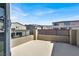 Open-air balcony with railings offers views of the neighborhood homes on a sunny day at 1297 Ventura Cliffs Ave, Henderson, NV 89012