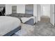 View from the carpeted bedroom shows a comfortable gray sofa and artwork at 1297 Ventura Cliffs Ave, Henderson, NV 89012