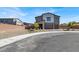 Charming two-story home with desert landscaping and a three-car garage at 1297 Ventura Cliffs Ave, Henderson, NV 89012