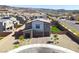 Beautiful two-story home with a well-manicured front yard and a three-car garage, showcasing modern architecture at 1297 Ventura Cliffs Ave, Henderson, NV 89012