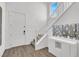 Bright foyer featuring a staircase, stylish flooring, and modern decor at 1297 Ventura Cliffs Ave, Henderson, NV 89012