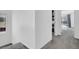 Well-lit hallway with closet and window offer functional space and natural light at 1297 Ventura Cliffs Ave, Henderson, NV 89012