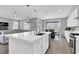 Open-concept kitchen featuring a center island, modern appliances, and seamless flow to the living space at 1297 Ventura Cliffs Ave, Henderson, NV 89012