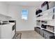 Functional laundry room with ample shelving and modern washer/dryer appliances at 1297 Ventura Cliffs Ave, Henderson, NV 89012