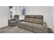 Relaxing living room with a gray reclining sofa and recliner, perfect for entertainment at 1297 Ventura Cliffs Ave, Henderson, NV 89012
