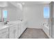 This main bathroom has double sinks, plenty of cabinet space, and a separate bathtub and shower at 1297 Ventura Cliffs Ave, Henderson, NV 89012