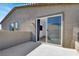 This patio has a sliding glass door that leads to the inside, and space for outdoor seating at 1297 Ventura Cliffs Ave, Henderson, NV 89012
