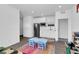 Playroom featuring a toy kitchen, table with chairs, and white cabinets with stainless steel refrigerator at 1297 Ventura Cliffs Ave, Henderson, NV 89012