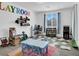 Spacious playroom with organized shelves of toys and a table for creative activities at 1297 Ventura Cliffs Ave, Henderson, NV 89012