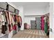 This walk-in closet has organization shelving and storage for clothes and personal items at 1297 Ventura Cliffs Ave, Henderson, NV 89012