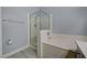 Bathroom featuring a shower, a soaking tub, toilet paper holder, and white tile at 1501 Oscar Ct # 101, Las Vegas, NV 89146