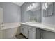 Bathroom featuring a soaking tub, sink with vanity, shower, and large mirror at 1501 Oscar Ct # 101, Las Vegas, NV 89146