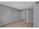 The bedroom features a closet with sliding mirrored doors and beautiful wood-look flooring at 1501 Oscar Ct # 101, Las Vegas, NV 89146