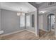 Cozy dining room with modern lighting and an arched doorway leading to bathroom at 1501 Oscar Ct # 101, Las Vegas, NV 89146