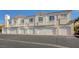 Garage parking for these attached condos featuring white garage doors at 1501 Oscar Ct # 101, Las Vegas, NV 89146