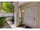 Inviting entryway with security gate, lush greenery, and well-maintained landscaping at 1501 Oscar Ct # 101, Las Vegas, NV 89146