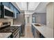 Updated kitchen with quartz countertops and stainless steel appliances at 1501 Oscar Ct # 101, Las Vegas, NV 89146