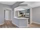 Modern kitchen with breakfast bar and stainless steel appliances at 1501 Oscar Ct # 101, Las Vegas, NV 89146