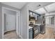 Galley kitchen features stainless steel appliances, blue cabinets, and recessed lighting at 1501 Oscar Ct # 101, Las Vegas, NV 89146