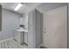 The laundry room features a white washer and dryer, cabinets, and light wood flooring at 1501 Oscar Ct # 101, Las Vegas, NV 89146