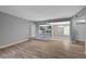 Open-concept living room with modern flooring and a view of the kitchen area at 1501 Oscar Ct # 101, Las Vegas, NV 89146