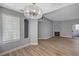 Well-lit living room featuring modern flooring, a window, and a cozy fireplace at 1501 Oscar Ct # 101, Las Vegas, NV 89146