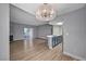 Open living space featuring sleek floors, modern lighting, and a small fireplace at 1501 Oscar Ct # 101, Las Vegas, NV 89146