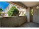 Outdoor patio with neutral colors and small plants with building in the background at 1501 Oscar Ct # 101, Las Vegas, NV 89146