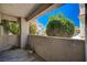 Outdoor patio with neutral colors and small plants with building in the background at 1501 Oscar Ct # 101, Las Vegas, NV 89146