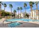Stunning community pool and spa, surrounded by meticulously kept grounds and palm trees at 1501 Oscar Ct # 101, Las Vegas, NV 89146