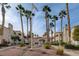 Santa Margarita community signage with mature landscaping and palm trees on a sunny day at 1501 Oscar Ct # 101, Las Vegas, NV 89146