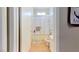 Bright bathroom features a tub-shower combo with glass doors and simple vanity at 1569 Hialeah Dr, Las Vegas, NV 89119
