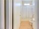 Bright bathroom features a tub-shower combo with glass doors and simple vanity at 1569 Hialeah Dr, Las Vegas, NV 89119