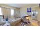 Bedroom with neutral tones, a window, and furnishings; a cozy and inviting space at 1569 Hialeah Dr, Las Vegas, NV 89119