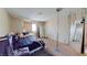 Bedroom with neutral decor, carpet, and window; furnished with bed and other items at 1569 Hialeah Dr, Las Vegas, NV 89119