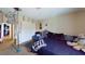 Bedroom with neutral tones and a full-size bed and various furnishings around the room at 1569 Hialeah Dr, Las Vegas, NV 89119