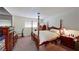 Bright bedroom with a four poster bed, large window, and a dresser with lots of storage space at 1569 Hialeah Dr, Las Vegas, NV 89119