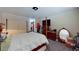 Spacious bedroom with a large bed, dresser, closet, and ample natural light at 1569 Hialeah Dr, Las Vegas, NV 89119
