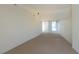 Open living area with neutral carpet and paint, ready for new homeowners at 1569 Hialeah Dr, Las Vegas, NV 89119