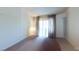 Bright main bedroom featuring an expansive window with a view at 1569 Hialeah Dr, Las Vegas, NV 89119