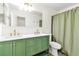Updated bathroom featuring dual sinks, stylish fixtures, large mirror, and shower-tub combo at 1679 Raindance Way, Las Vegas, NV 89169