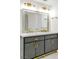 Elegant bathroom featuring a double vanity with gold fixtures, creating a spa-like experience at 1679 Raindance Way, Las Vegas, NV 89169