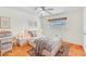 Bright bedroom with a ceiling fan, stylish décor, a window and natural light at 1679 Raindance Way, Las Vegas, NV 89169