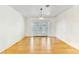 Spacious empty room showcasing hardwood floors and French doors at 1679 Raindance Way, Las Vegas, NV 89169