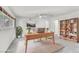 Bright home office with a desk, shelving, and ample natural light, perfect for productivity at 1679 Raindance Way, Las Vegas, NV 89169