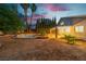 Backyard with pool, mature trees, and covered patio for outdoor relaxation at 1808 Piccolo Way, Las Vegas, NV 89146