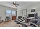 Bedroom features a large window, wood floors, and ample space for musical instruments or a work space at 1808 Piccolo Way, Las Vegas, NV 89146