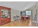 Dining room features hardwood floors and wooden table with seating for six at 1808 Piccolo Way, Las Vegas, NV 89146